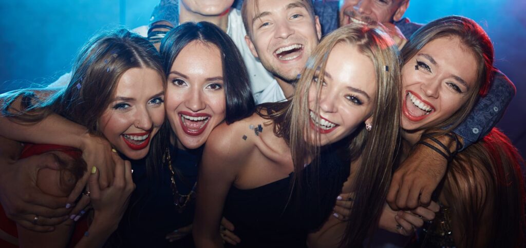 Vibrant nightclub scene in Maroochydore on the Sunshine Coast with colorful lights and a dancing crowd.